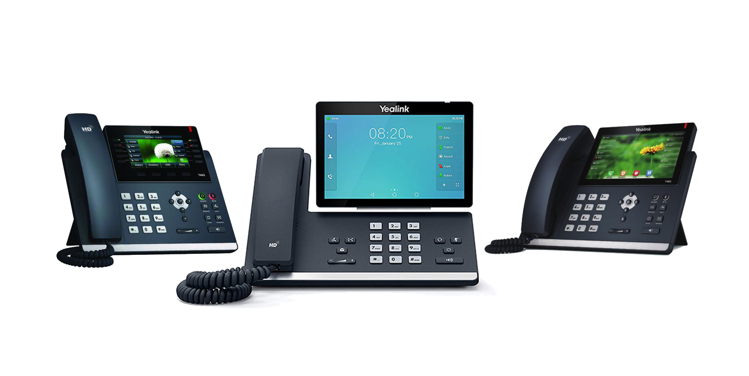 Three business desk phones of the kind that work unchanged on a VoIP line